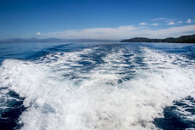 Scenic view of sea against blue sky