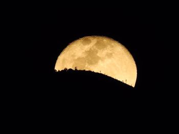 Scenic view of moon against clear sky at night