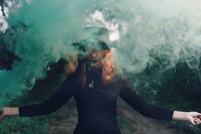 Young woman standing in park