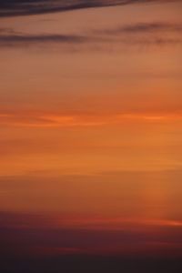 Scenic view of sea against romantic sky at sunset