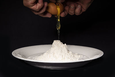 Close-up of person hand holding ice cream