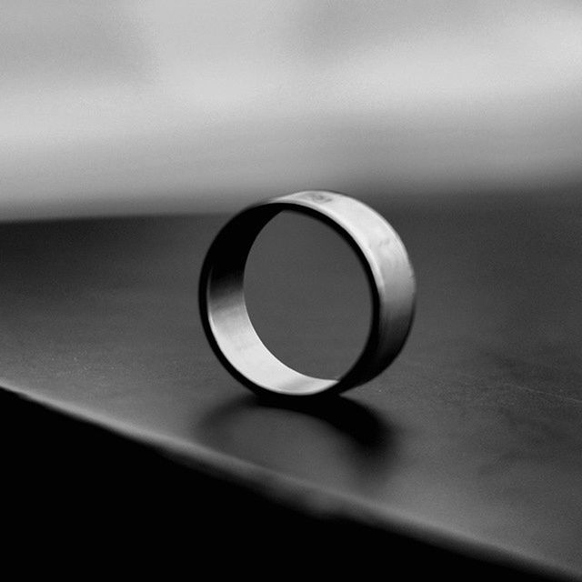 indoors, still life, close-up, coffee cup, table, selective focus, focus on foreground, copy space, no people, single object, wall - building feature, home interior, white color, simplicity, reflection, technology, circle, white, metal, geometric shape