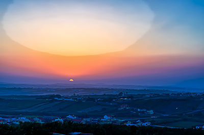 Scenic view of landscape against sky during sunset