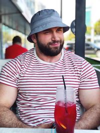 Portrait of man wearing hat