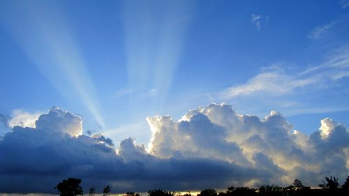 Scenic view of landscape against cloudy sky