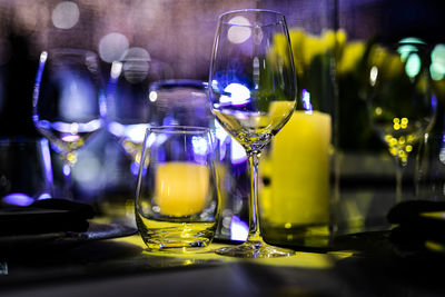 Drinking glass on table in restaurant