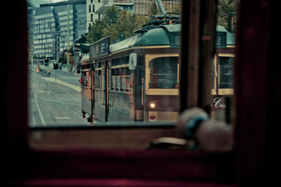 City street seen through window