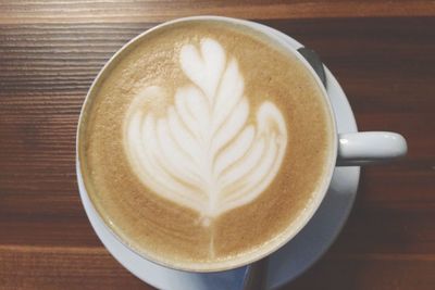 Close-up of cappuccino on table