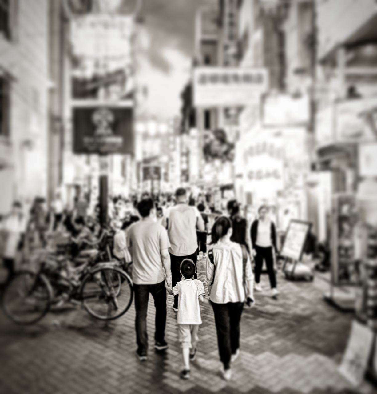 GROUP OF PEOPLE WALKING ON STREET