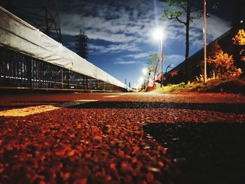 Surface level of road against sky in city