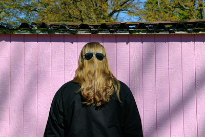 Rear view of woman wearing sunglasses on head