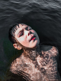 High angle portrait of woman in water
