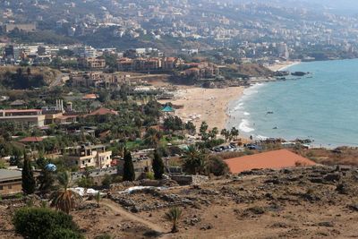 High angle view of townscape by sea