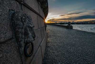 View of statue of street during sunset