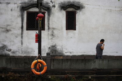 Man in front of building