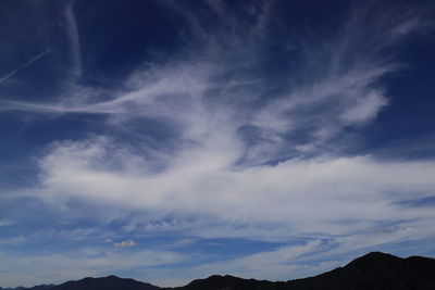Low angle view of silhouette mountain against sky