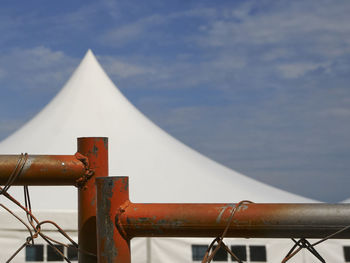 Close-up of metal structure against sky