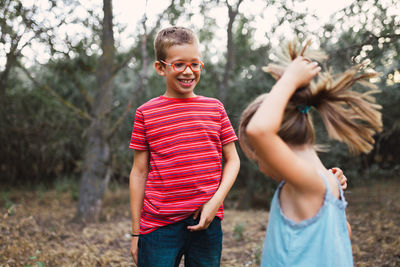 Portrait of smiling girl standing on land