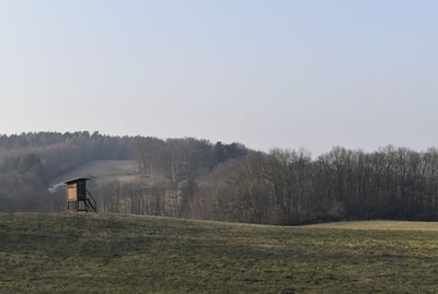 Scenic view of field against clear sky