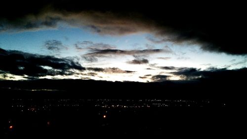 Scenic view of landscape against sky at night