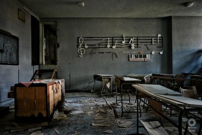 Empty chairs in abandoned building