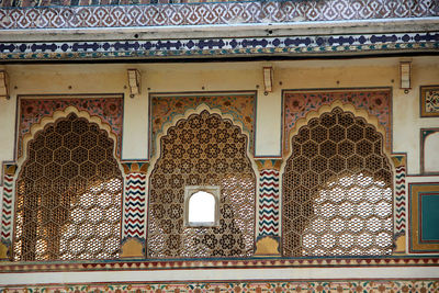 Low angle view of ornate window on building