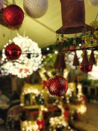 Close-up of christmas decorations hanging on tree