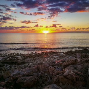 Scenic view of sea against sky during sunset