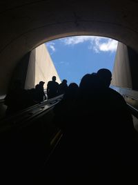 Low angle view of people against sky