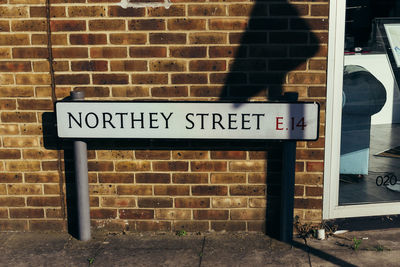 Information sign on brick wall