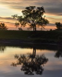 Scenic view of lake at sunset