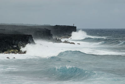 Waves splashing on rocks