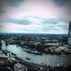Cityscape against cloudy sky