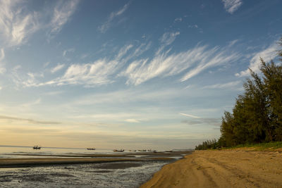 Scenic view of beach against sky during sunset