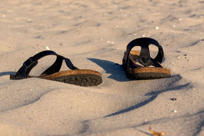 High angle view of shoes on sand