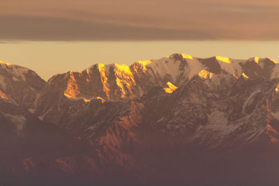 Scenic view of mountain against sky during sunset