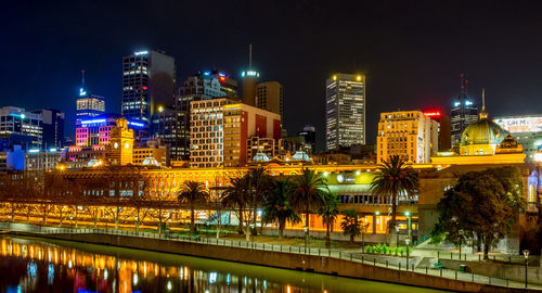 Illuminated buildings in city at night