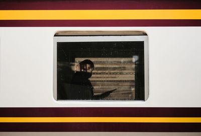 Shadows of people in train carriages