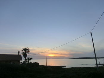 Scenic view of sea against sky at sunset