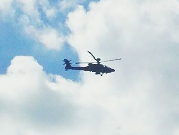 Low angle view of airplane flying in sky