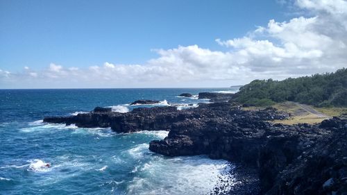 Scenic view of sea against blue sky