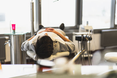 Man lying down on bed at dental clinic