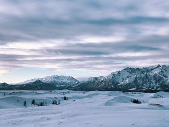 Scenic view of snowcapped mountains against sky