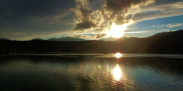 Scenic view of lake against sky during sunset