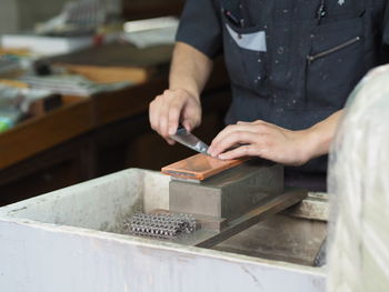 Close-up of man using mobile phone