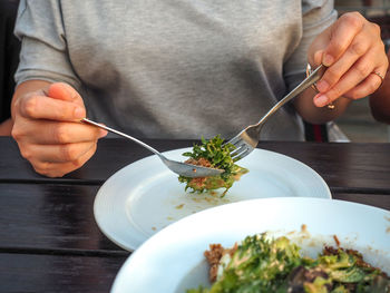 Midsection of man preparing food