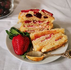 Close-up of cake with strawberries on table