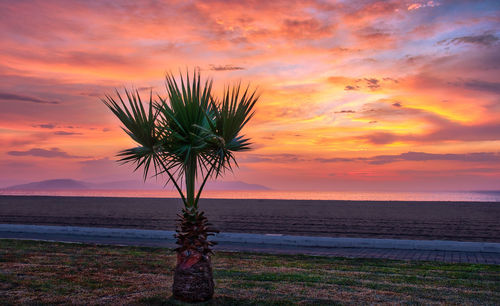 Scenic view of sea against romantic sky at sunset