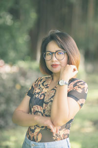 Portrait of young woman standing outdoors