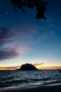 Scenic view of sea against sky at sunset